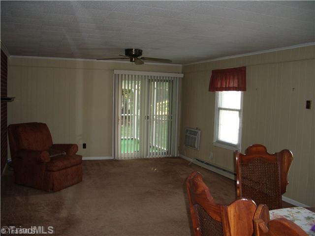 321 Stewart Road Southeast Winston-Salem, NC 27107 - Photo 5 of 8 Den/Family/Great Room. HUGE den/family room with atrium door leading to the screened porch.