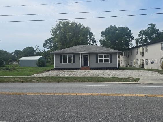 1628 East Gary Road Lakeland, FL 33801 - Photo 2 of 3 a front view of a house with a garden