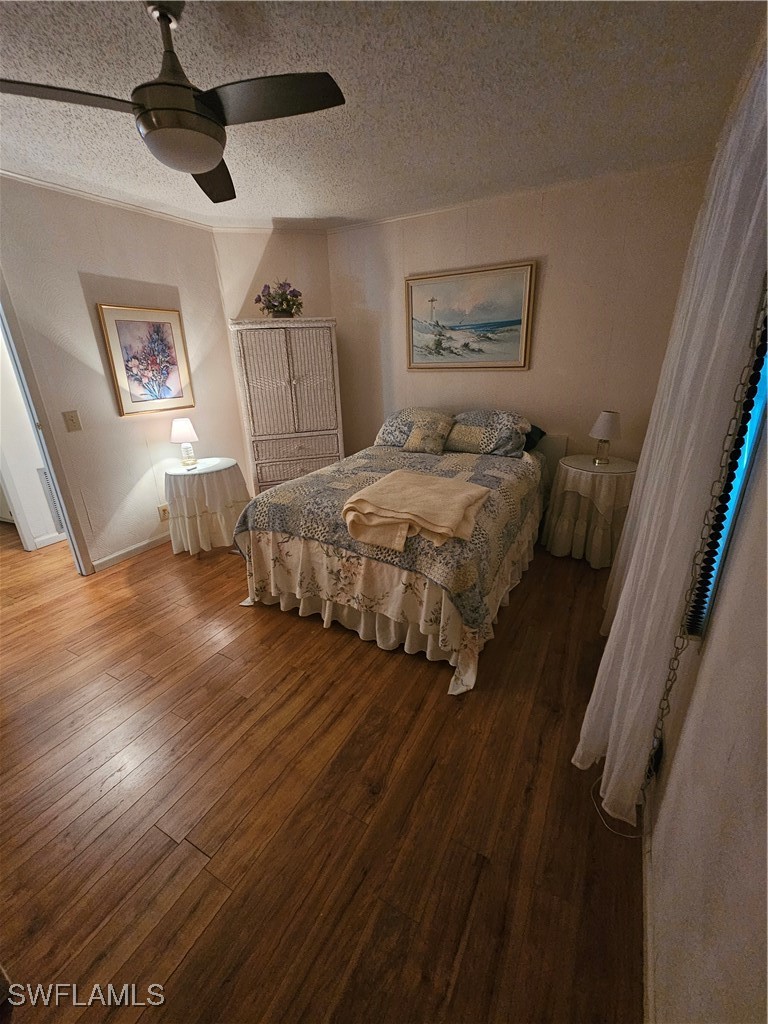 4 Elder Alva, FL 33920 - Photo 16 of 31 a spacious bedroom with a bed and a painting on the wall