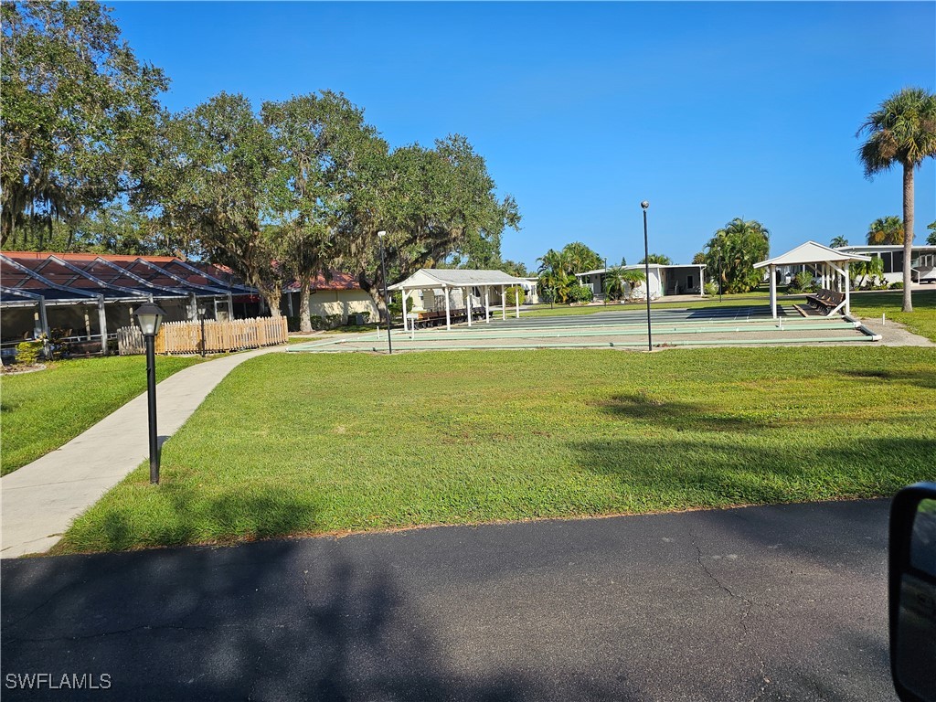 4 Elder Alva, FL 33920 - Photo 23 of 31 a front view of a house with a yard