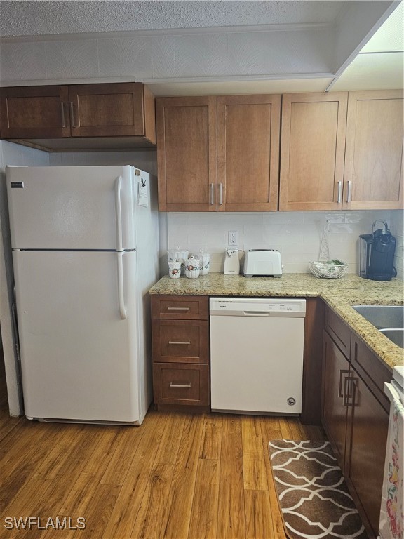 4 Elder Alva, FL 33920 - Photo 4 of 31 a kitchen with a refrigerator sink and cabinets