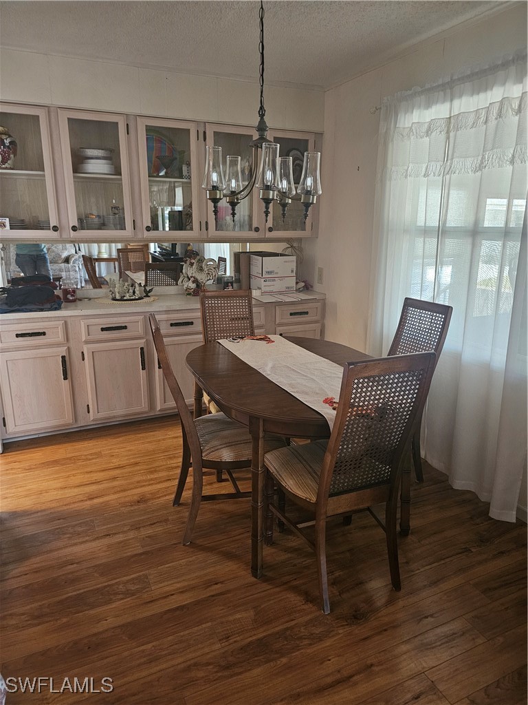 4 Elder Alva, FL 33920 - Photo 8 of 31 a view of a dining room with furniture window and wooden floor