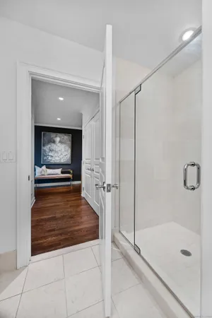 a bathroom with a shower and a tub