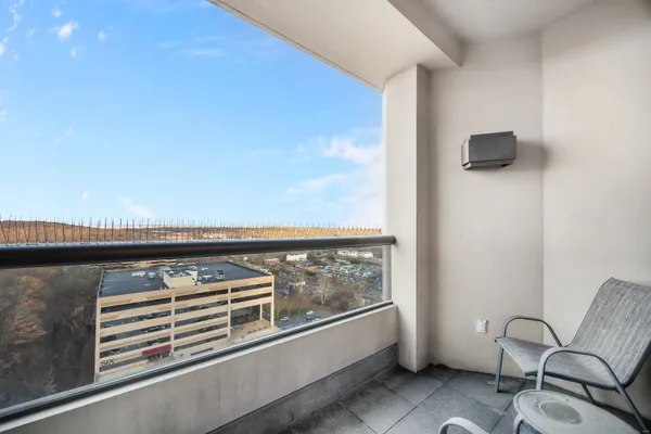 a view of a hallway with seating area
