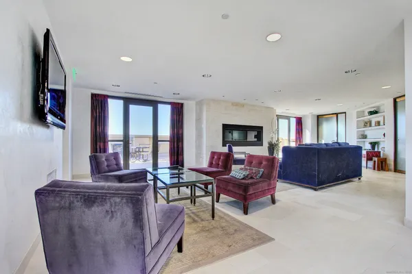 a bedroom with a bed and curtain