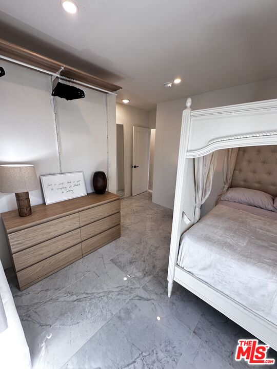 643 North Vista Street Los Angeles, CA 90036 - Photo 11 of 51 a bedroom with a bed and a walk in closet