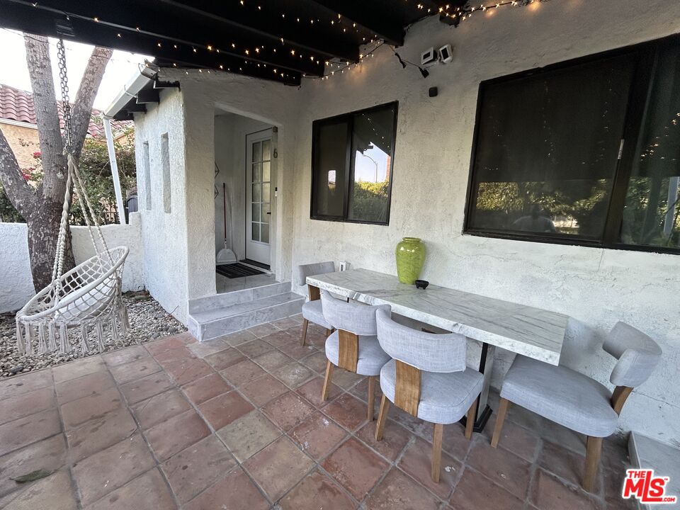 643 North Vista Street Los Angeles, CA 90036 - Photo 19 of 51 a living room with furniture a flat screen tv and a fireplace