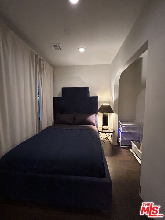 643 North Vista Street Los Angeles, CA 90036 - Photo 23 of 51 a bedroom with a bed and cabinets