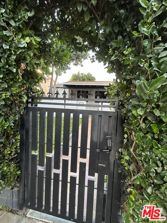 643 North Vista Street Los Angeles, CA 90036 - Photo 24 of 51 a view of a wooden fence and trees