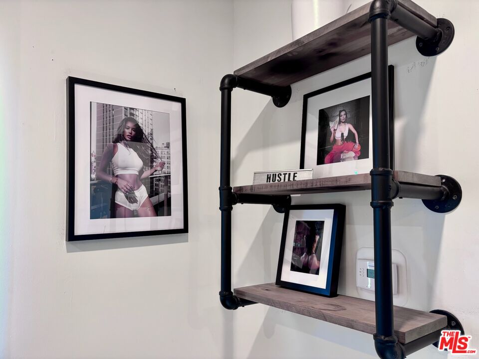 643 North Vista Street Los Angeles, CA 90036 - Photo 30 of 51 a view of a hallway with a painting on the wall