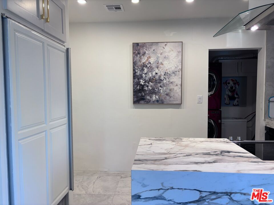 643 North Vista Street Los Angeles, CA 90036 - Photo 31 of 51 a bedroom with a bed and a painting on the wall