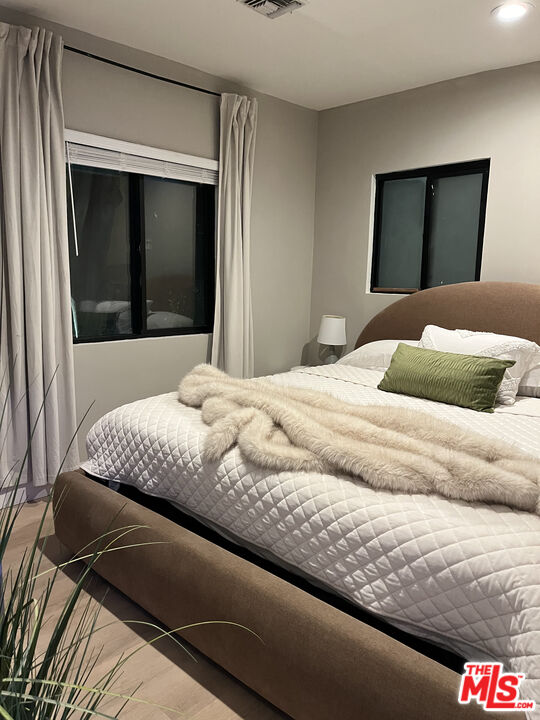 643 North Vista Street Los Angeles, CA 90036 - Photo 37 of 51 a bedroom with a bed and a mirror