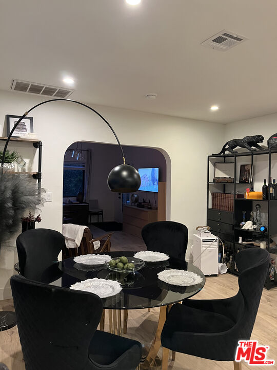 643 North Vista Street Los Angeles, CA 90036 - Photo 38 of 51 a living room with furniture and a wooden floor