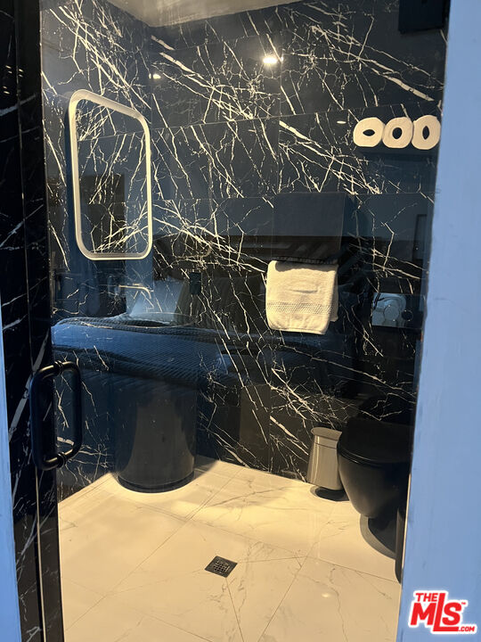 643 North Vista Street Los Angeles, CA 90036 - Photo 40 of 51 a bathroom with a sink and a mirror