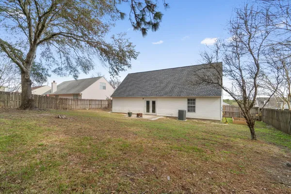 a house that has a tree in front of it