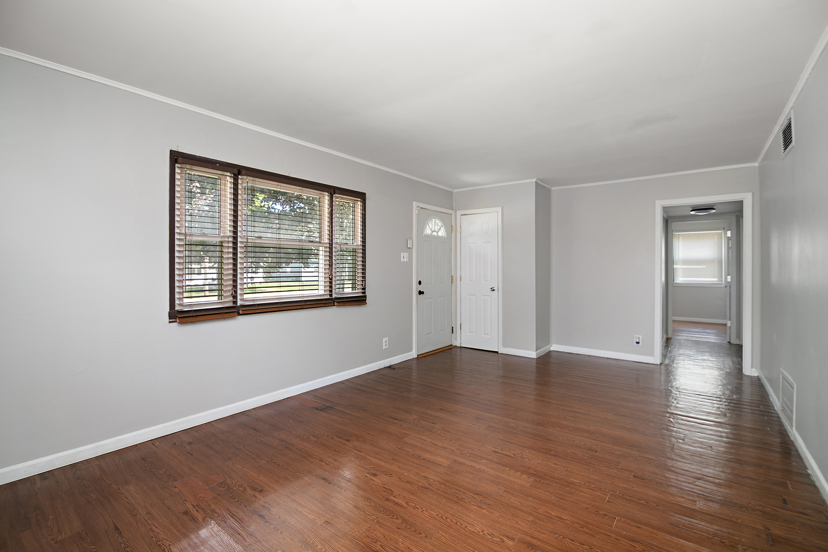 729 Webster Circle West Kankakee, IL 60901 - Photo 3 of 16 wooden floor in an empty room with a window
