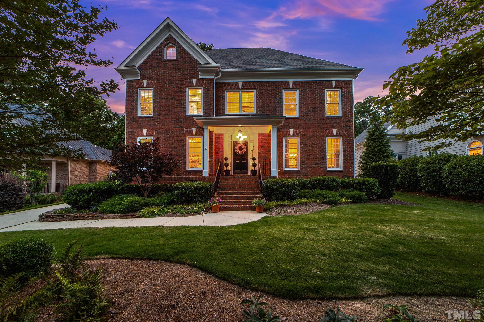 3205 Tall Tree Place Raleigh, NC 27607 - Photo 1 of 58 a front view of a house with a yard