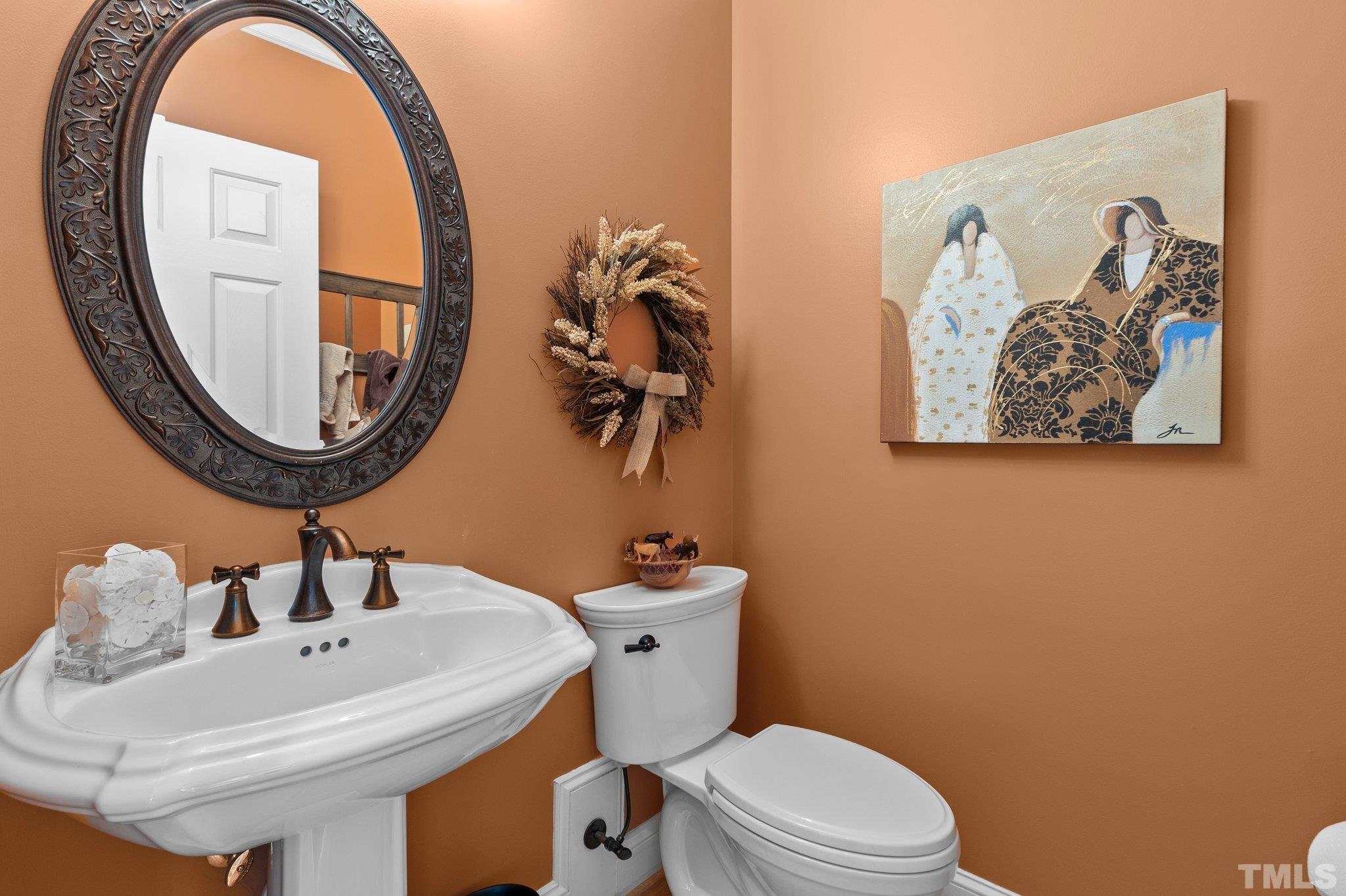 3205 Tall Tree Place Raleigh, NC 27607 - Photo 19 of 58 a bathroom with a sink and a mirror