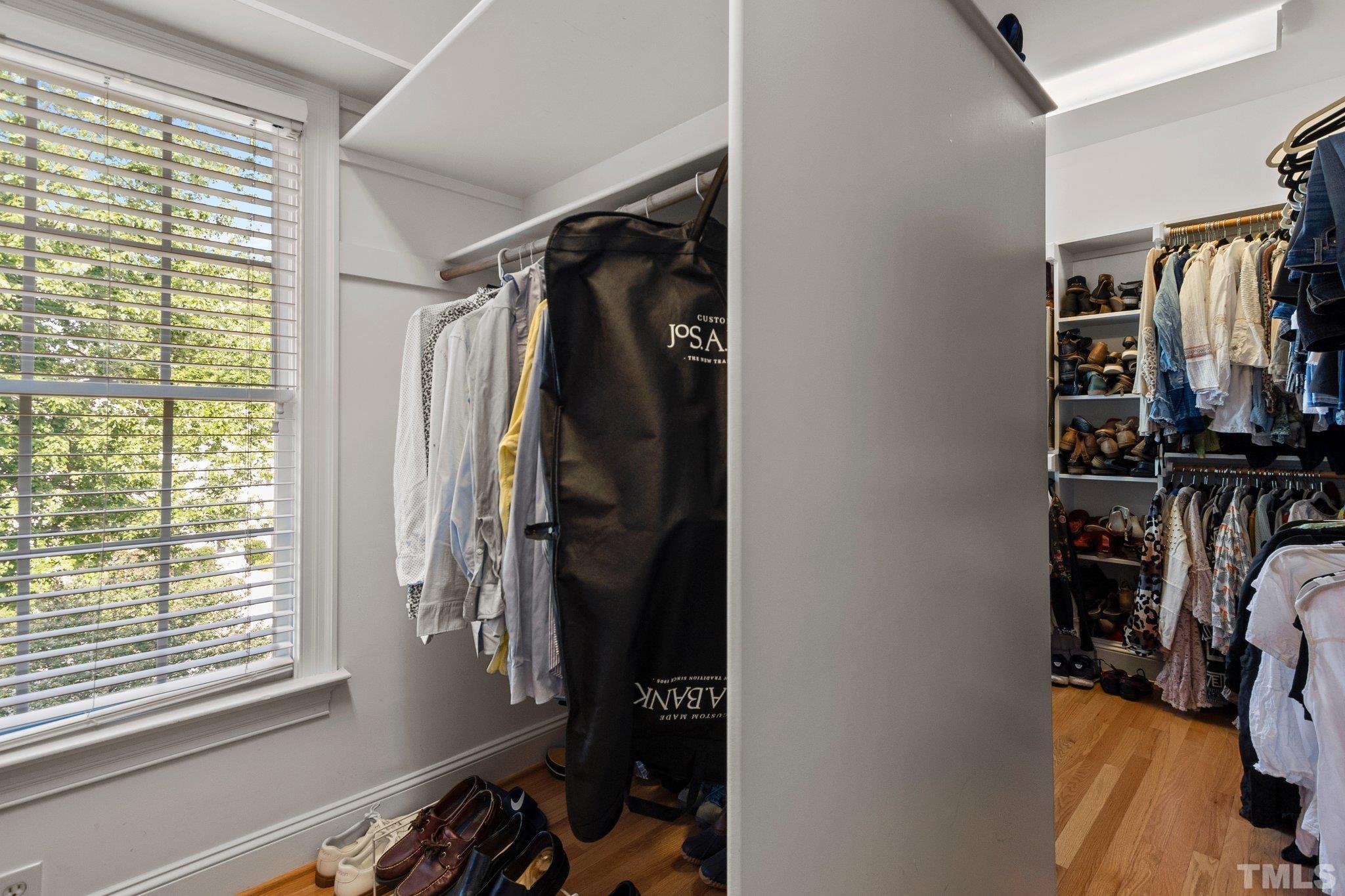 3205 Tall Tree Place Raleigh, NC 27607 - Photo 24 of 58 a view of walk in closet with clothes and shoes