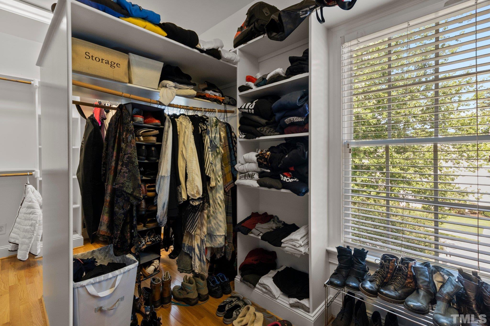 3205 Tall Tree Place Raleigh, NC 27607 - Photo 25 of 58 a view of walk in closet with clothes and shoes