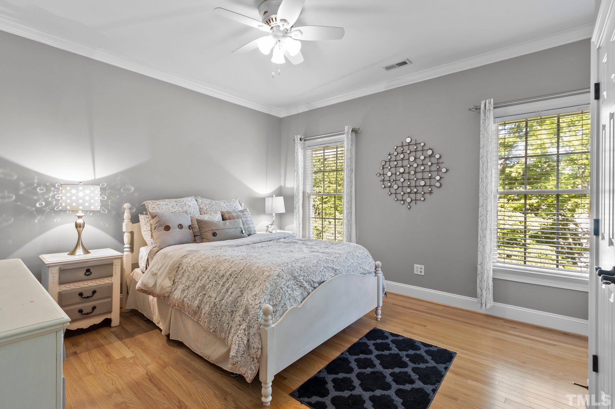 3205 Tall Tree Place Raleigh, NC 27607 - Photo 28 of 58 a bedroom with a bed and a window