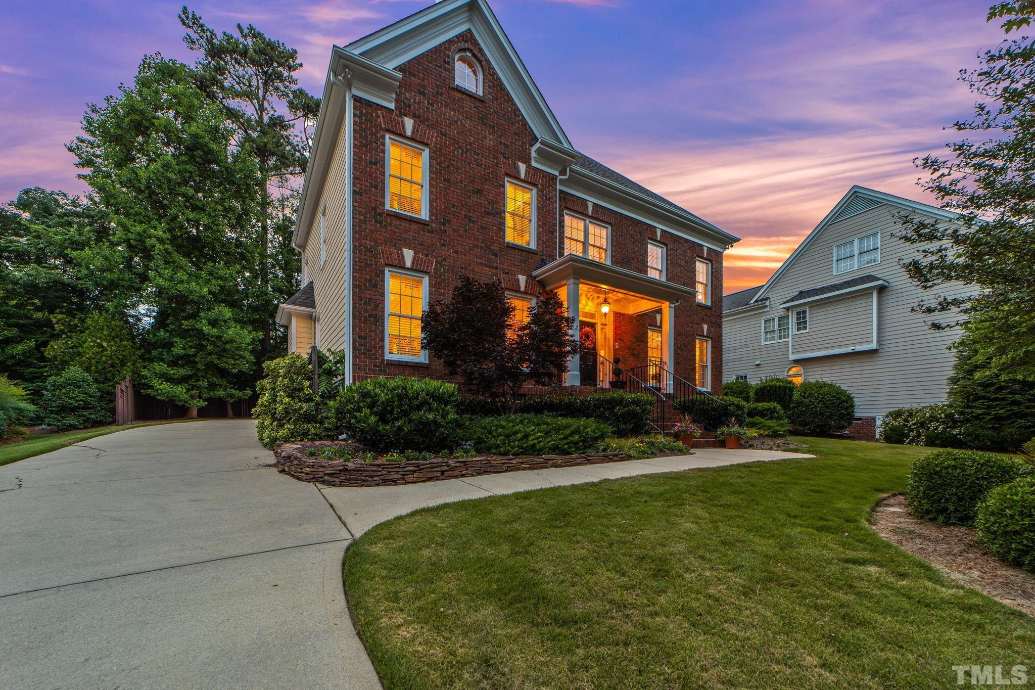 3205 Tall Tree Place Raleigh, NC 27607 - Photo 4 of 58 a view of a building with a yard