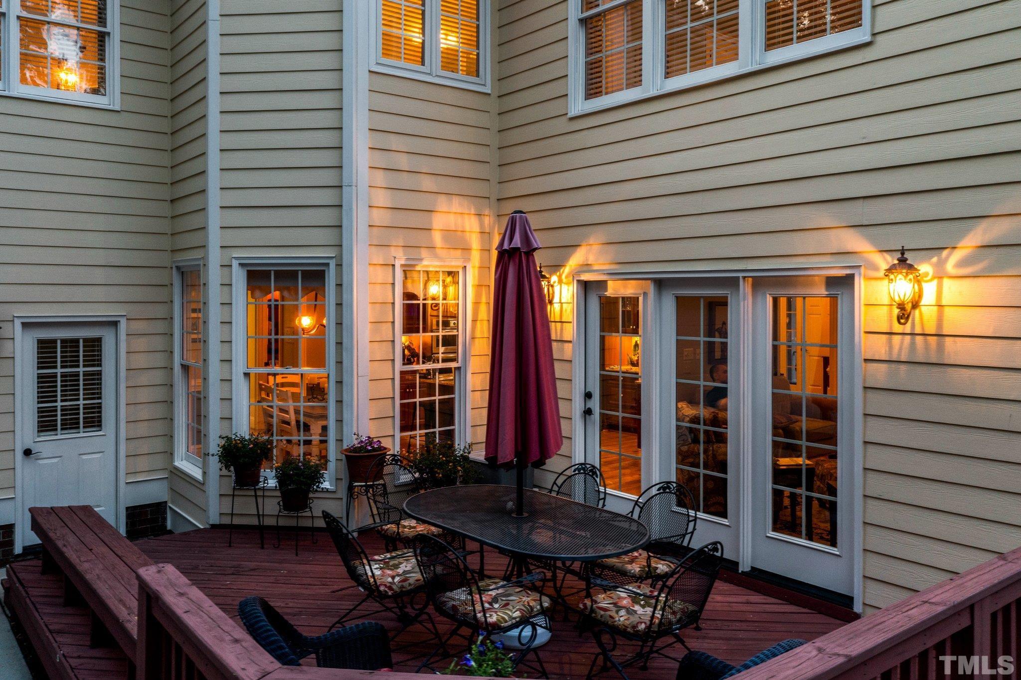 3205 Tall Tree Place Raleigh, NC 27607 - Photo 49 of 58 a table and chairs in front of a house