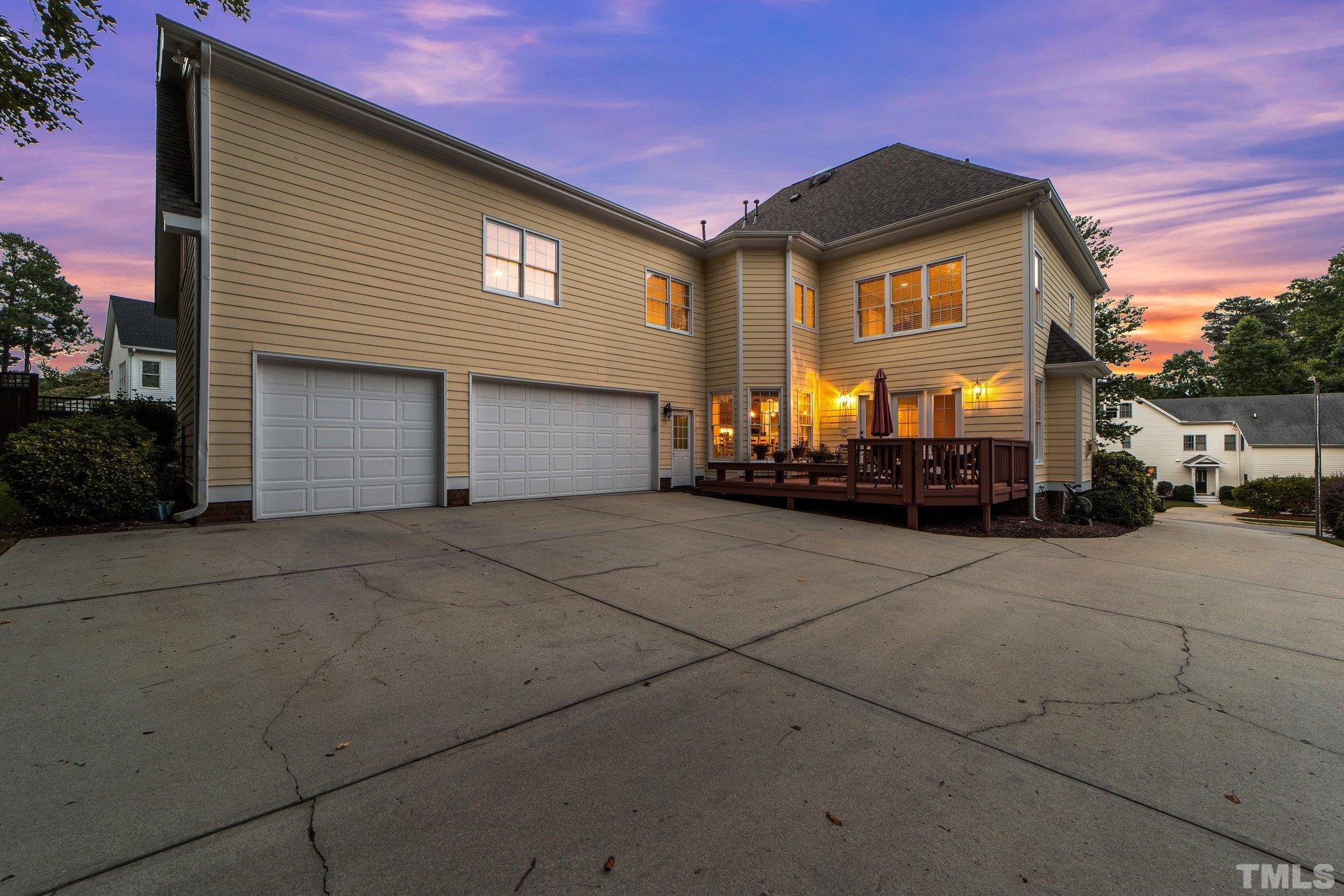 3205 Tall Tree Place Raleigh, NC 27607 - Photo 54 of 58 a front view of a house with a yard