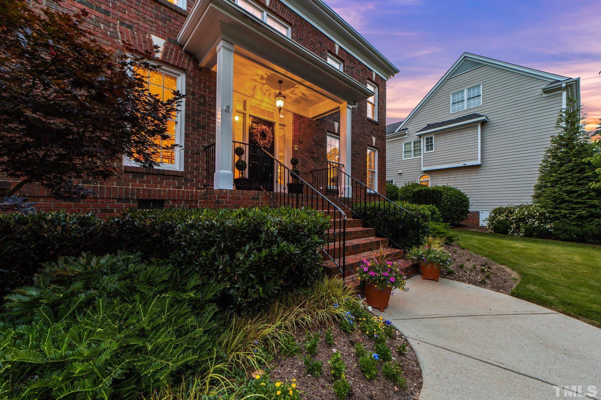 3205 Tall Tree Place Raleigh, NC 27607 - Photo 55 of 58 a front view of a house with garden