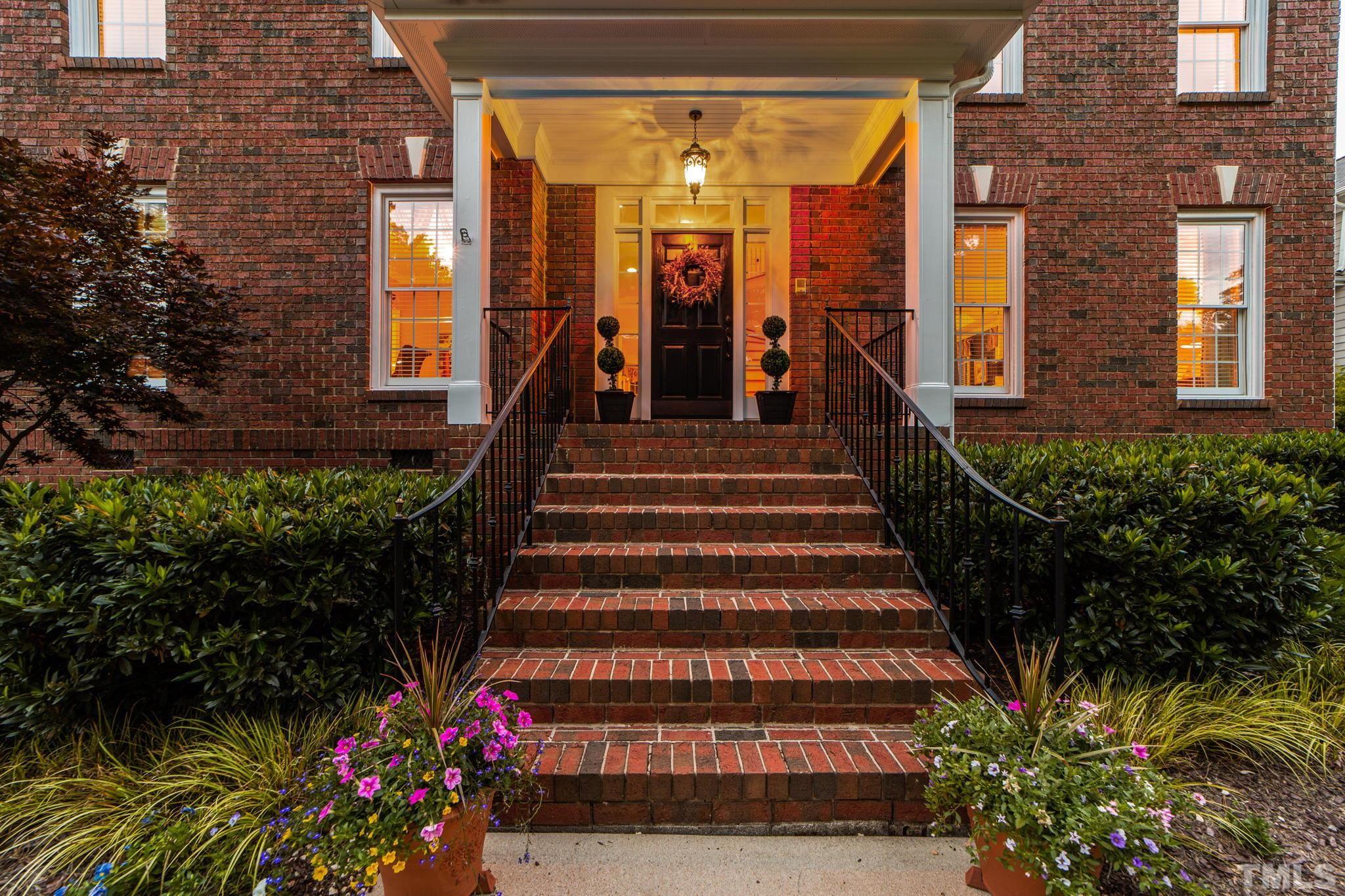 3205 Tall Tree Place Raleigh, NC 27607 - Photo 56 of 58 a view of a house with fountain and potted plants