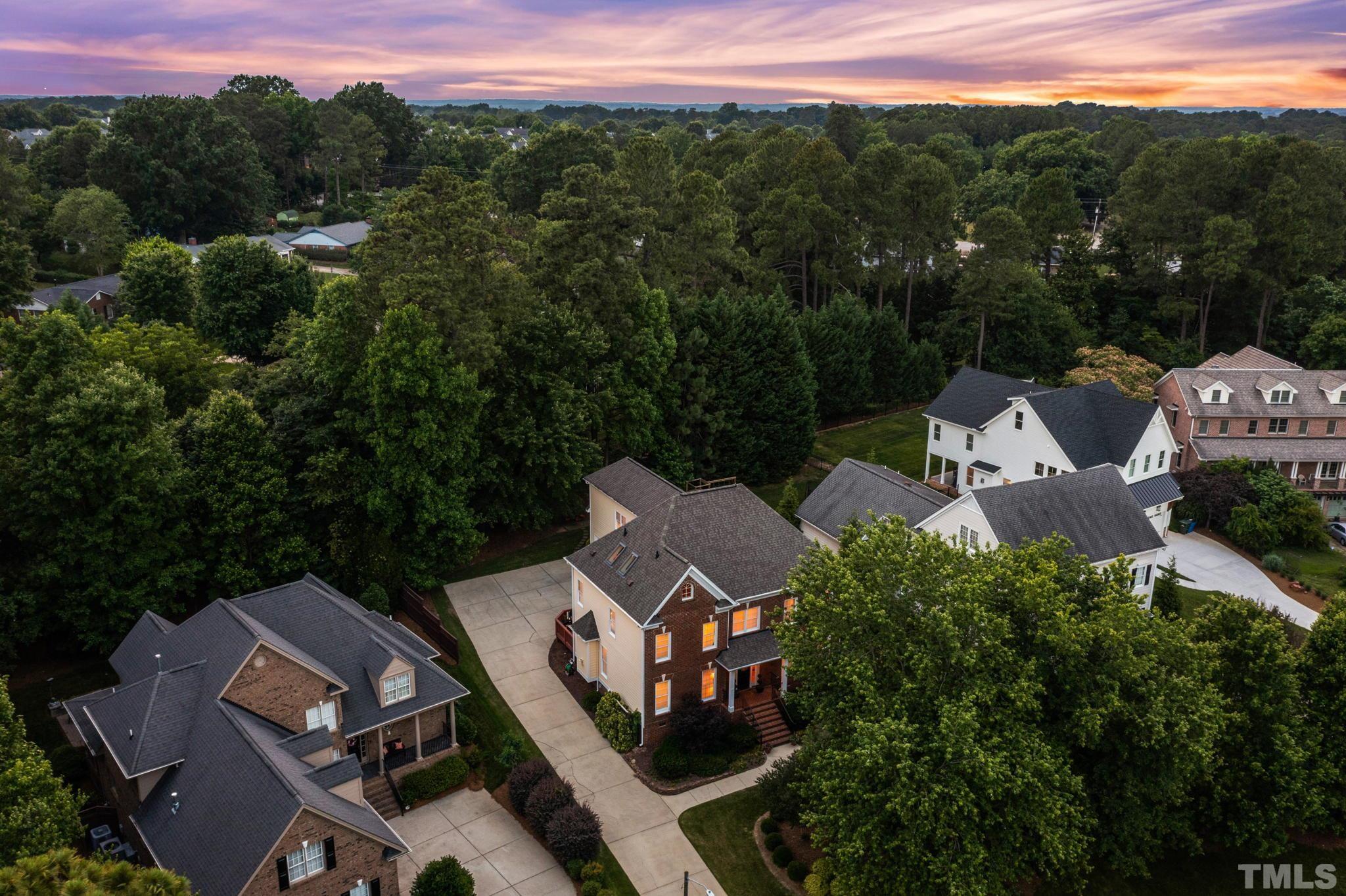 3205 Tall Tree Place Raleigh, NC 27607 - Photo 58 of 58 an aerial view of a house with a garden