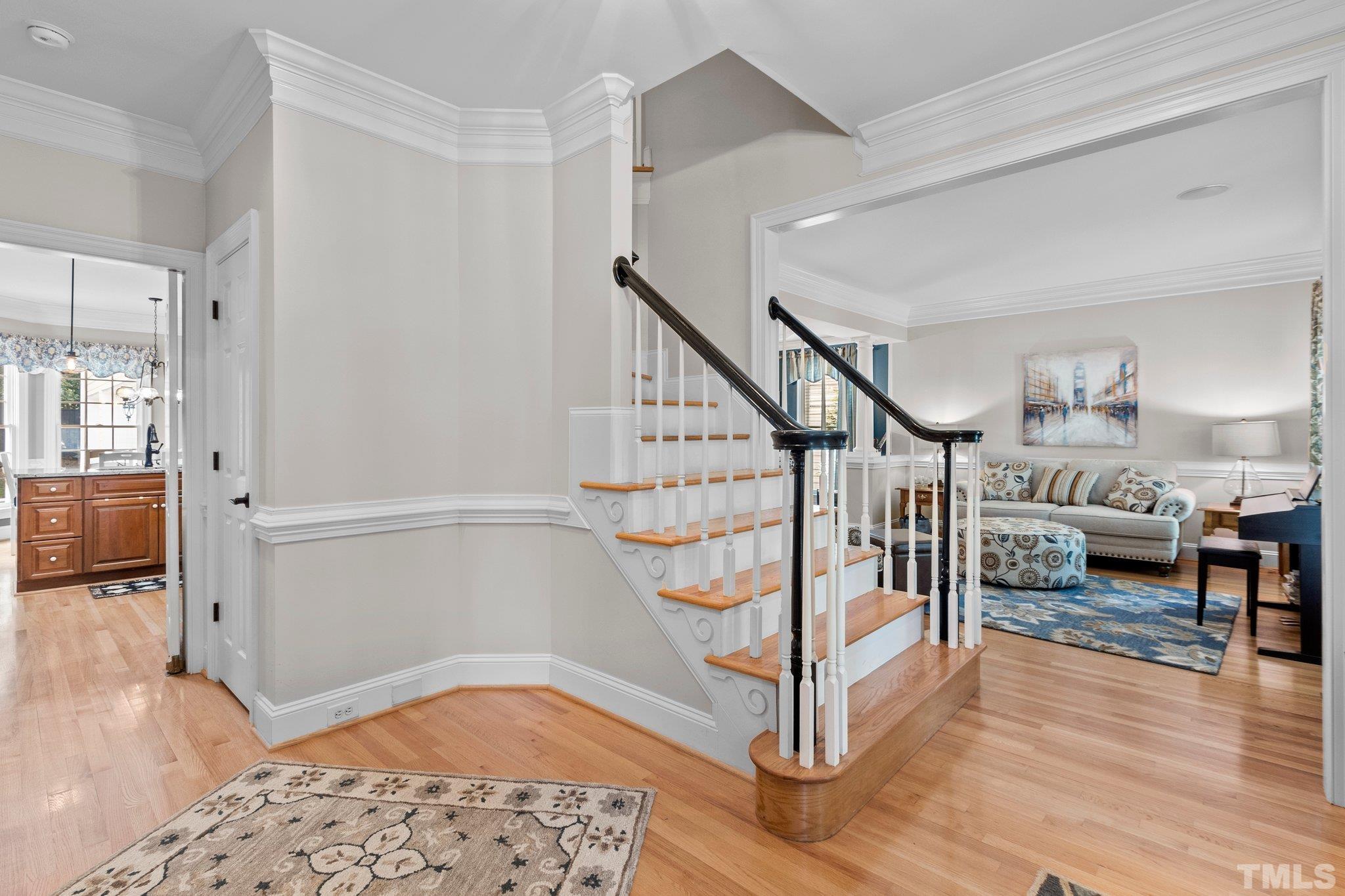 3205 Tall Tree Place Raleigh, NC 27607 - Photo 6 of 58 a view of entryway dining room and hall with wooden floor