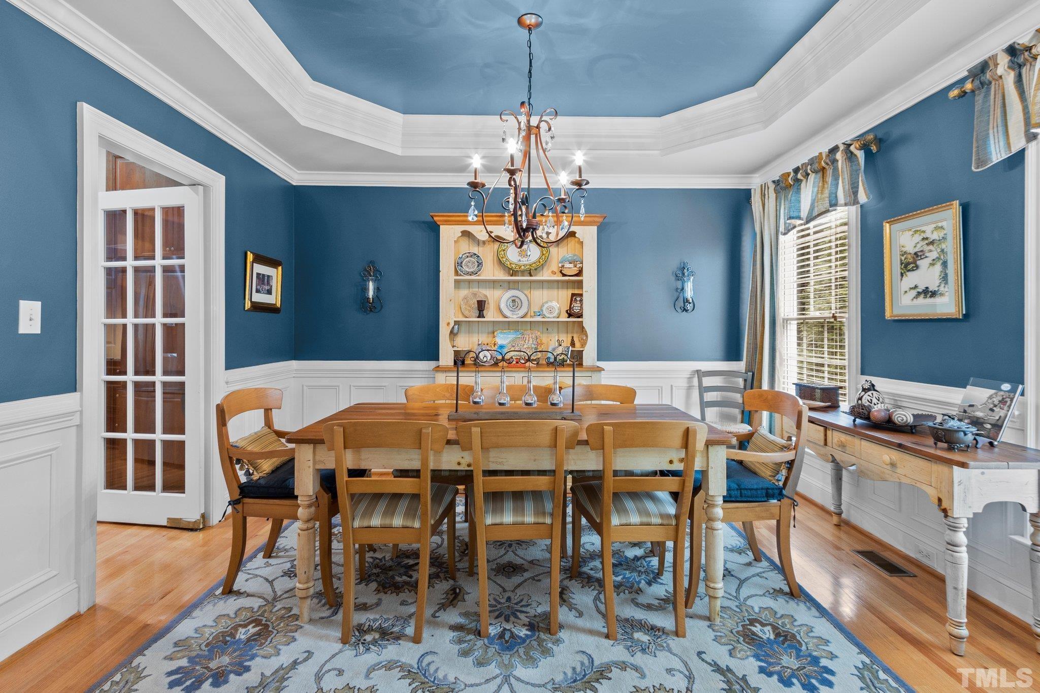 3205 Tall Tree Place Raleigh, NC 27607 - Photo 10 of 58 a view of a dining room with furniture window and wooden floor