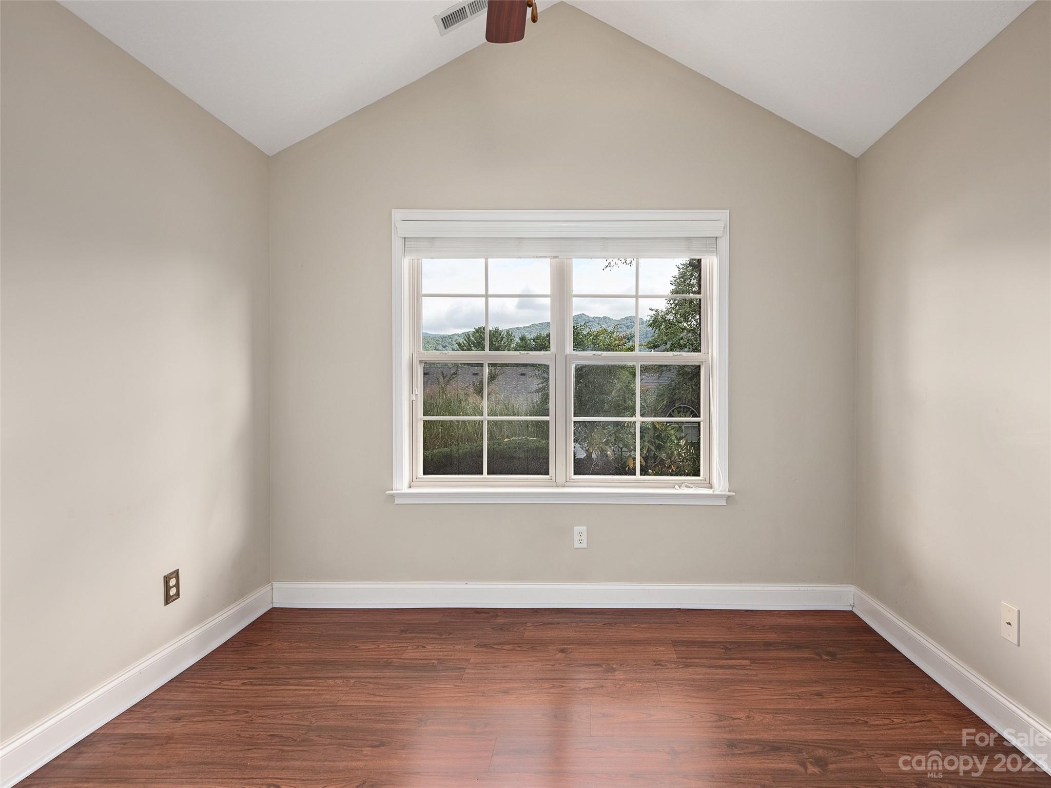 75 Outlook Circle Swannanoa, NC 28778 - Photo 15 of 31 an empty room with wooden floor and windows