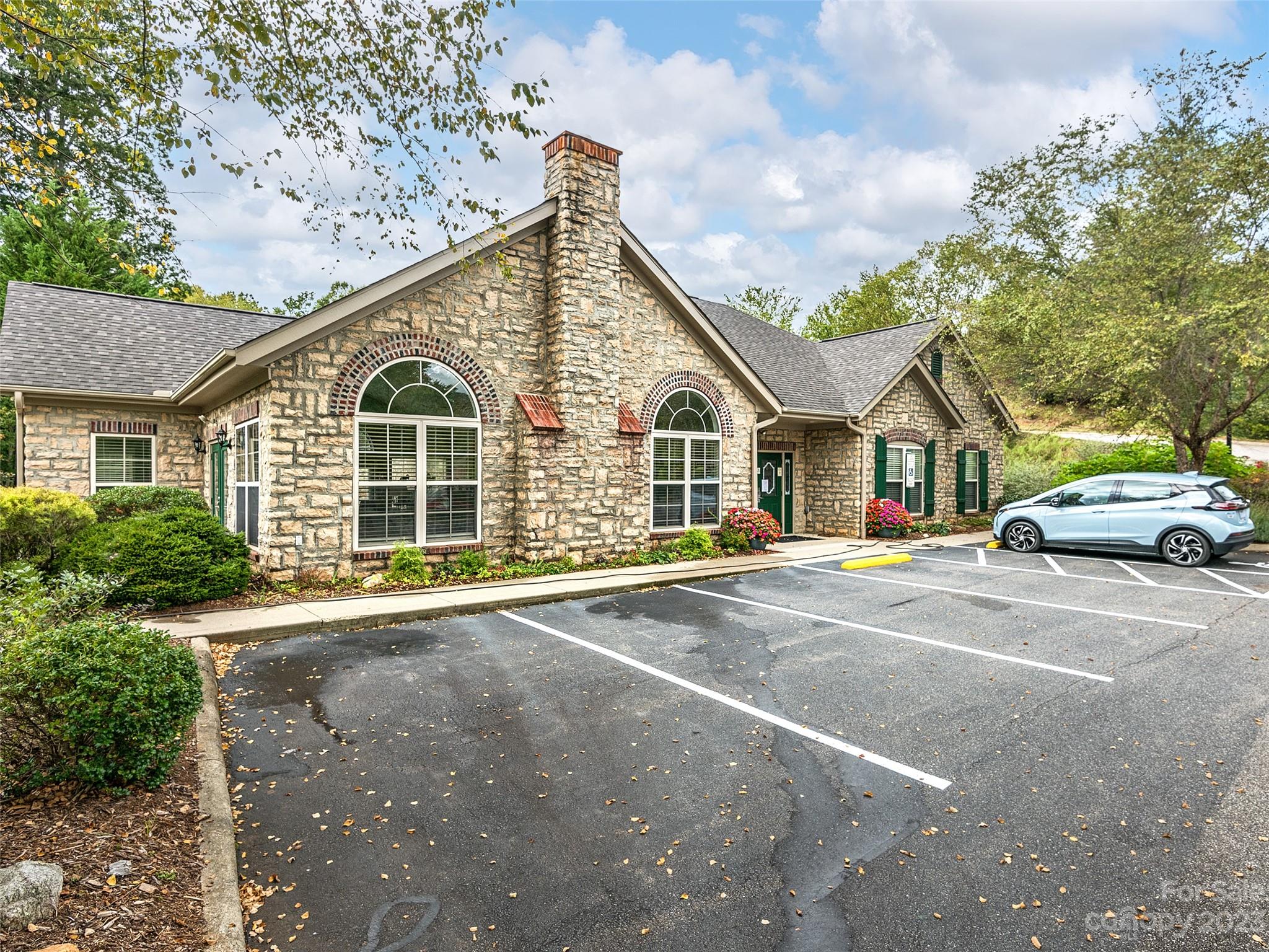 75 Outlook Circle Swannanoa, NC 28778 - Photo 22 of 31 a view of a white house next to a road and yard