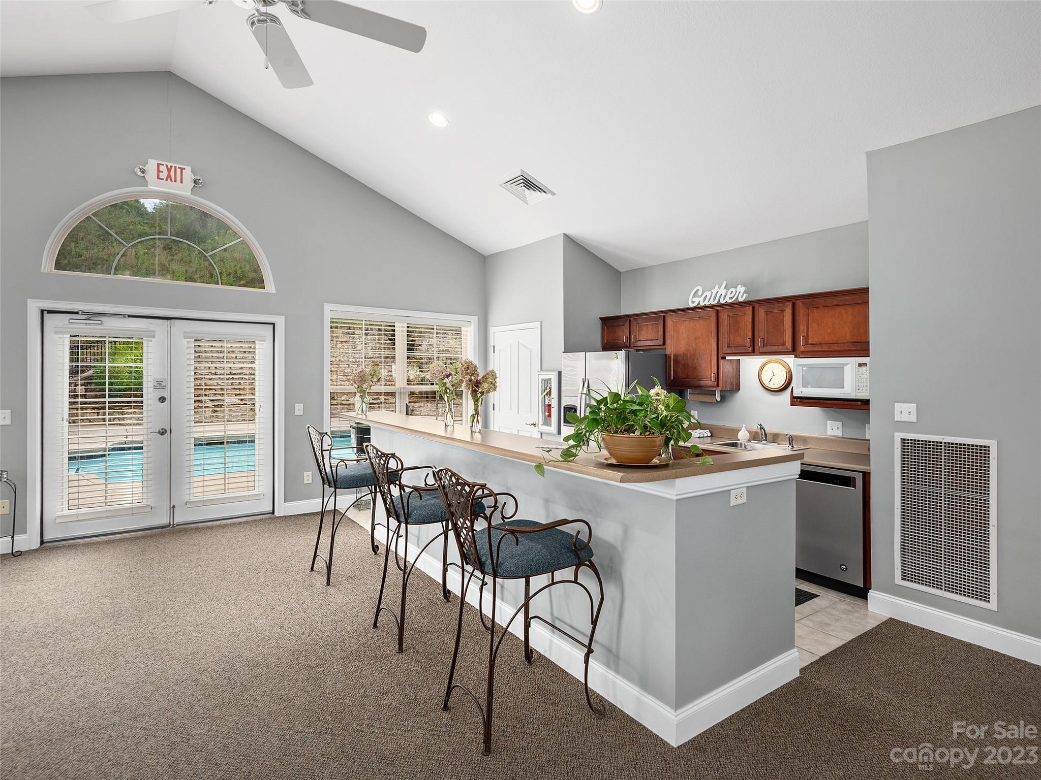 75 Outlook Circle Swannanoa, NC 28778 - Photo 27 of 31 a kitchen with stainless steel appliances kitchen island a table chairs in it and wooden floors