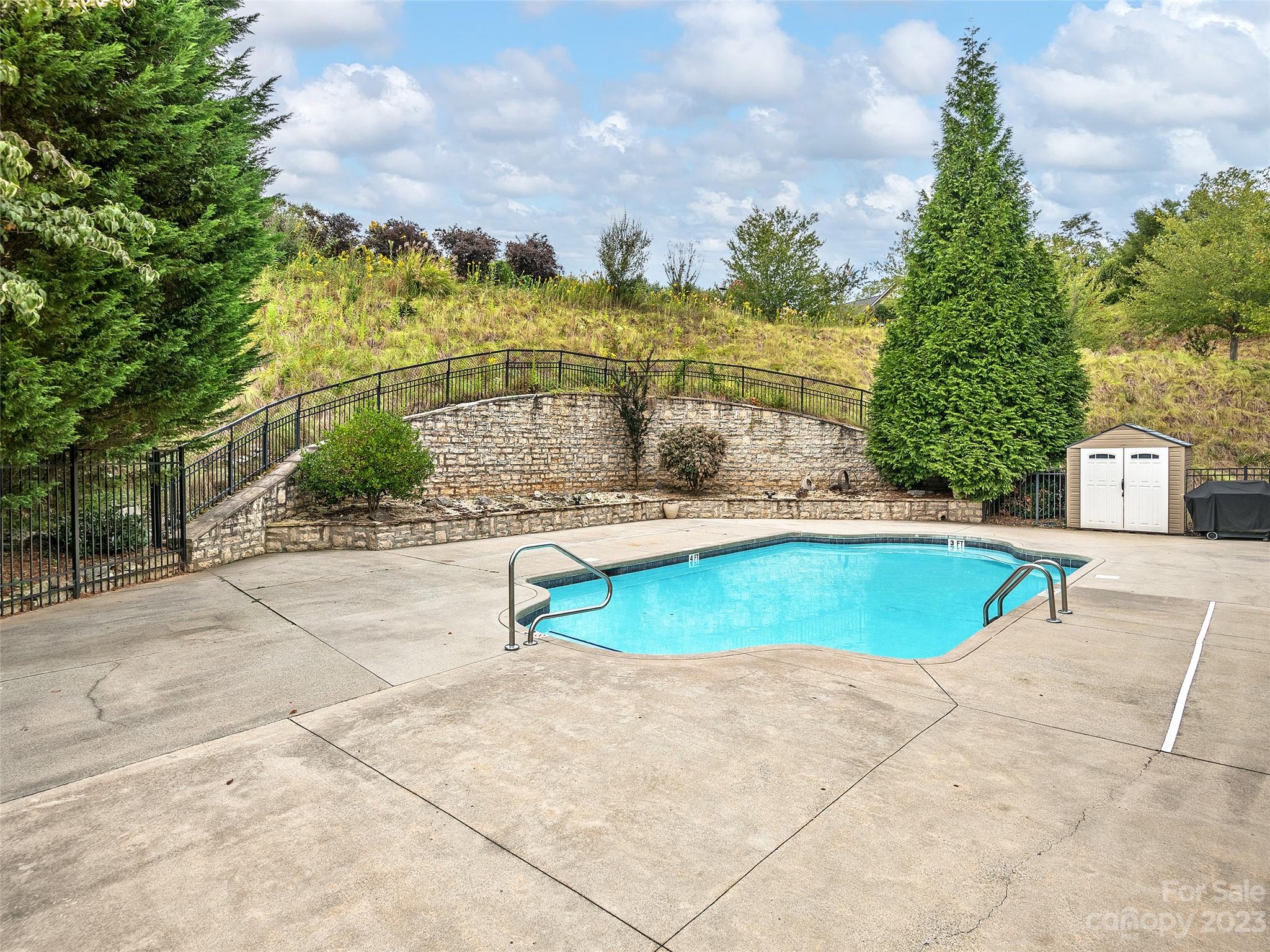 75 Outlook Circle Swannanoa, NC 28778 - Photo 28 of 31 a view of a swimming pool with a lawn chairs under an umbrella