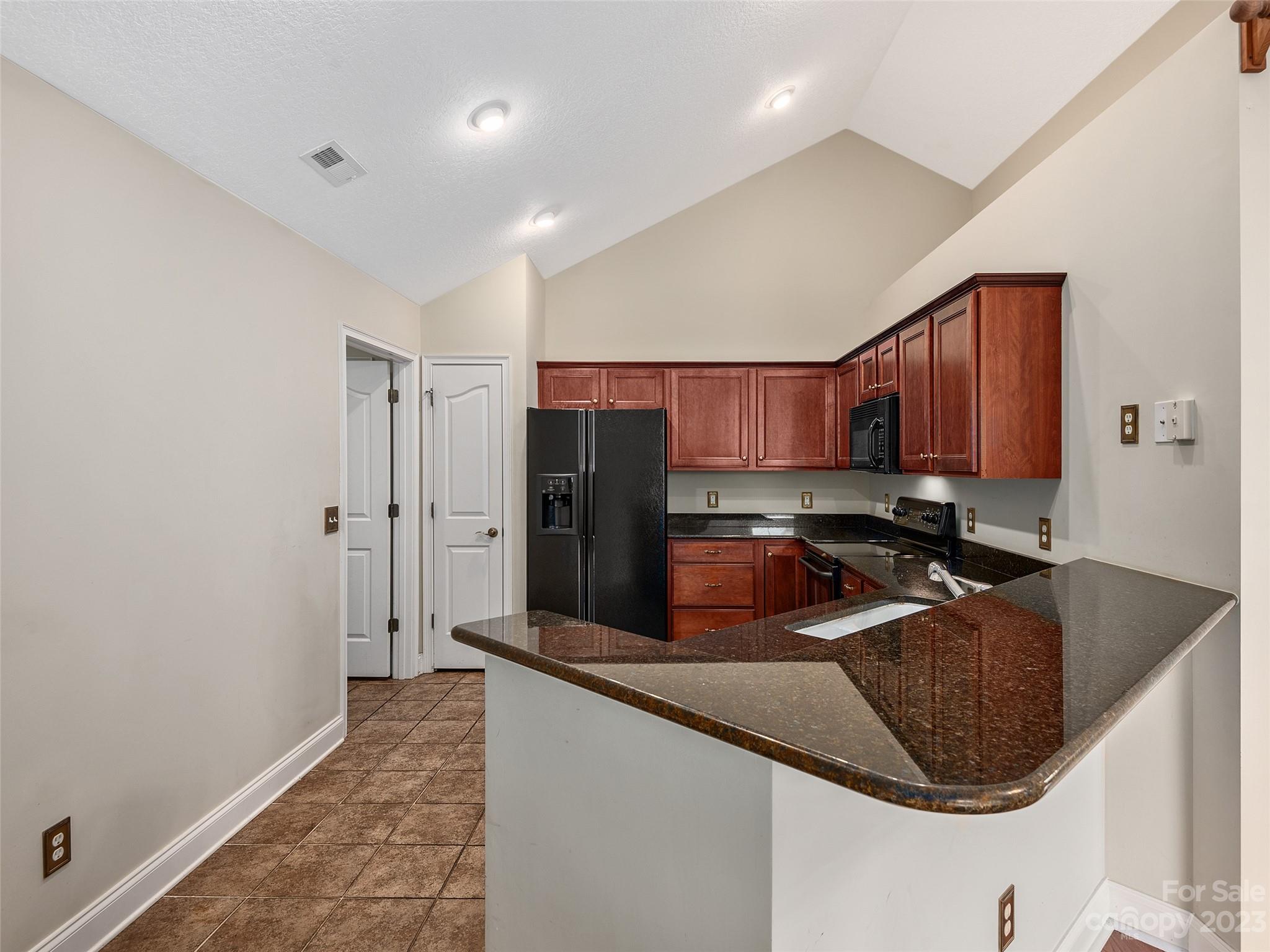75 Outlook Circle Swannanoa, NC 28778 - Photo 6 of 31 a kitchen with stainless steel appliances granite countertop a sink refrigerator and cabinets