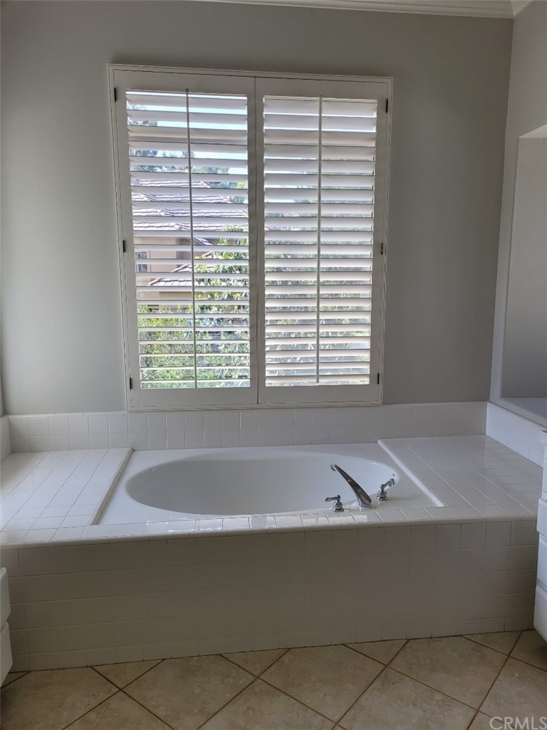 2 Belfort Newport Coast, CA 92657 - Photo 11 of 18 a bathroom with a bathtub and next to a window