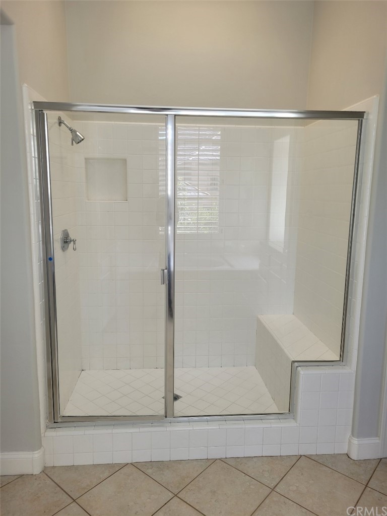 2 Belfort Newport Coast, CA 92657 - Photo 14 of 18 a bathroom with a glass shower door