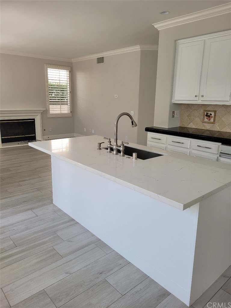 2 Belfort Newport Coast, CA 92657 - Photo 17 of 18 a kitchen with a sink and a stove top oven