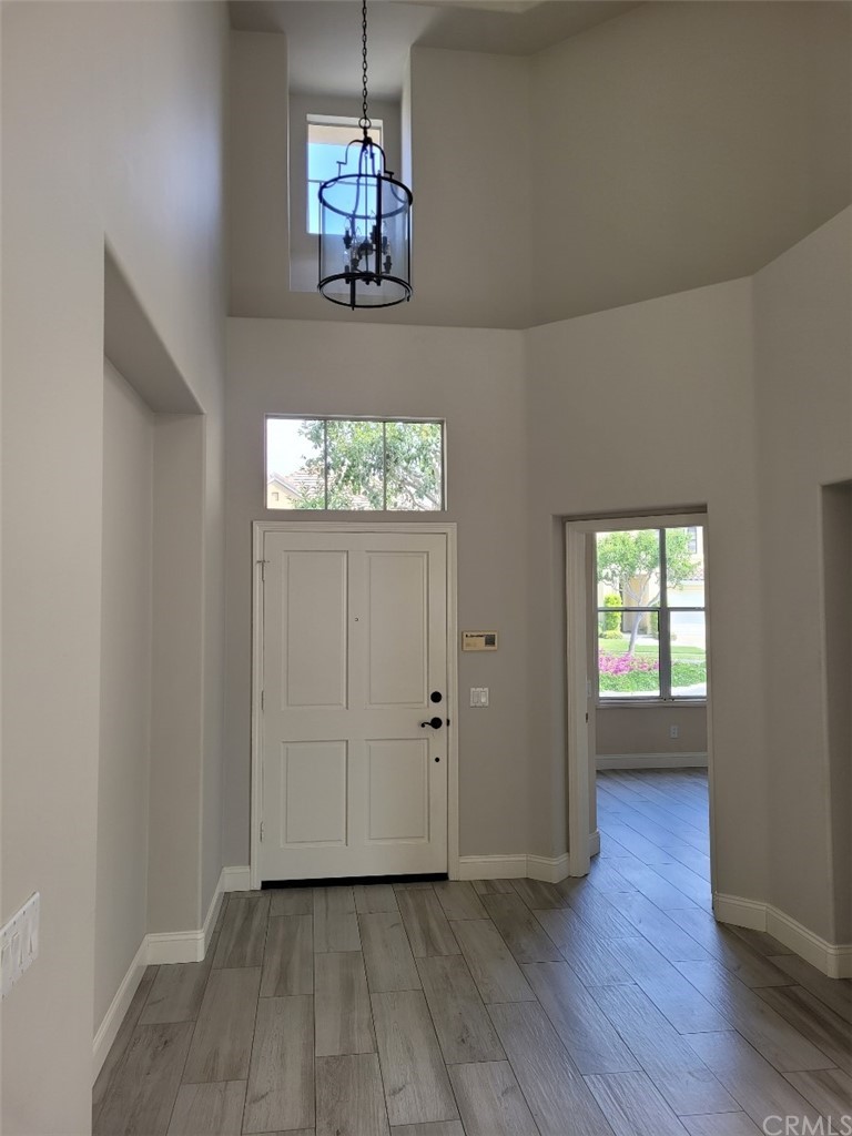 2 Belfort Newport Coast, CA 92657 - Photo 6 of 18 an empty room with wooden floor and windows