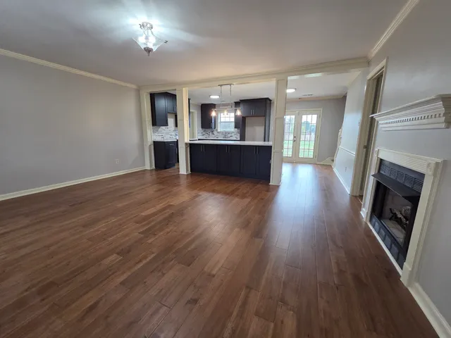 a view of a kitchen with a sink and a fireplace