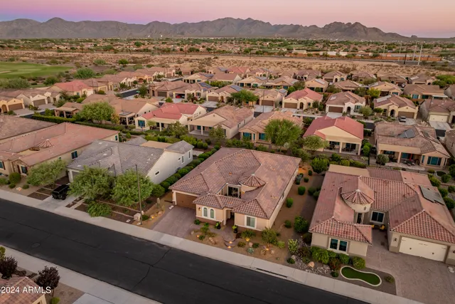 an aerial view of houses with outdoor space