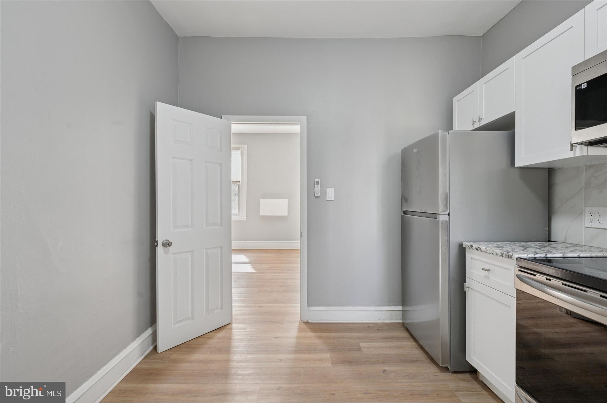 249 South 44th Street, Unit 4 Philadelphia, PA 19104 - Photo 12 of 25 a view of a kitchen with refrigerator and microwave