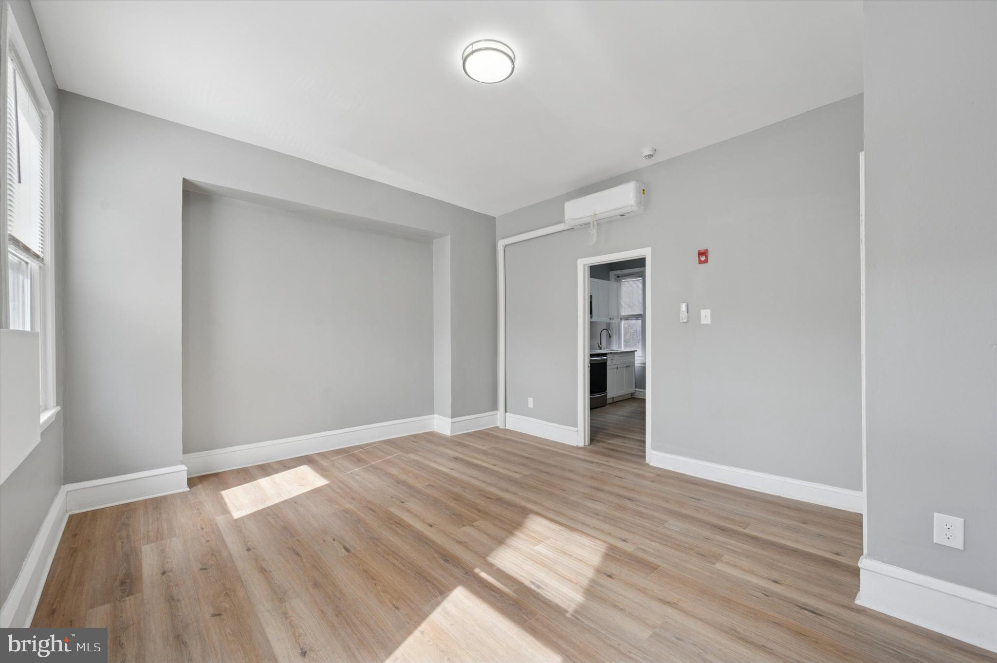 249 South 44th Street, Unit 4 Philadelphia, PA 19104 - Photo 18 of 25 wooden floor in an empty room with a window