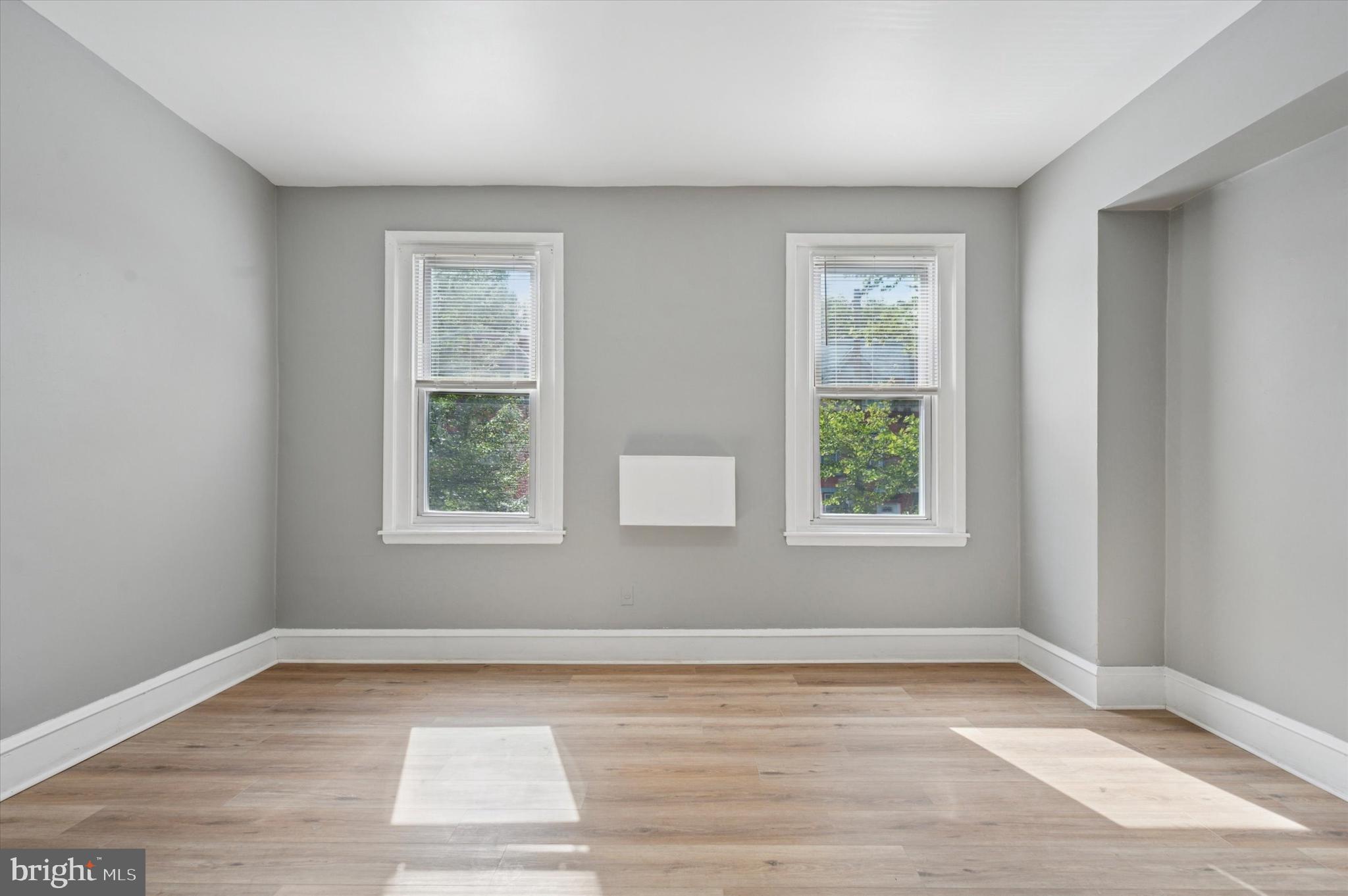 249 South 44th Street, Unit 4 Philadelphia, PA 19104 - Photo 20 of 25 a view of an empty room with wooden floor and a window