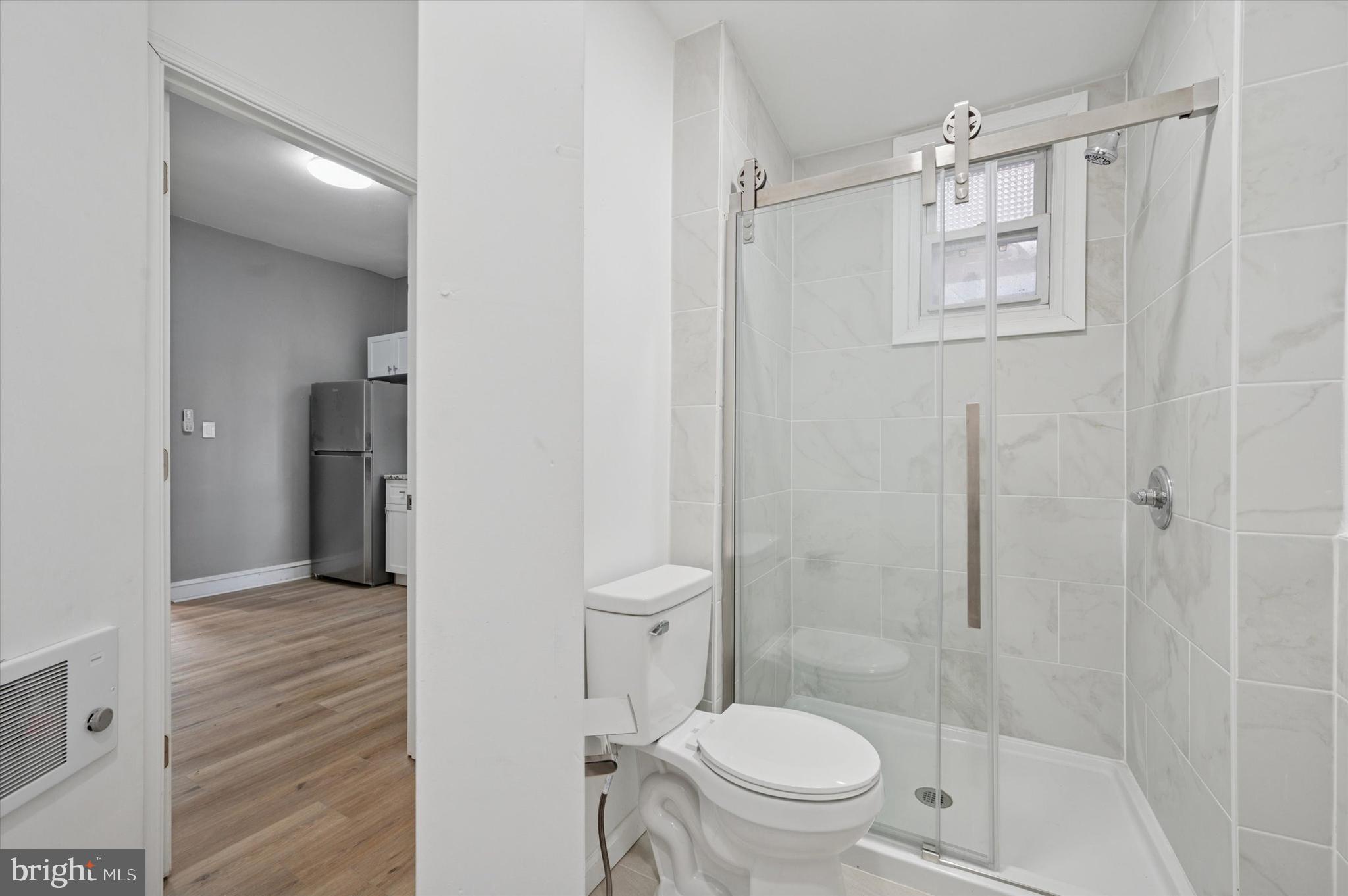 249 South 44th Street, Unit 4 Philadelphia, PA 19104 - Photo 24 of 25 a bathroom with a shower and a toilet