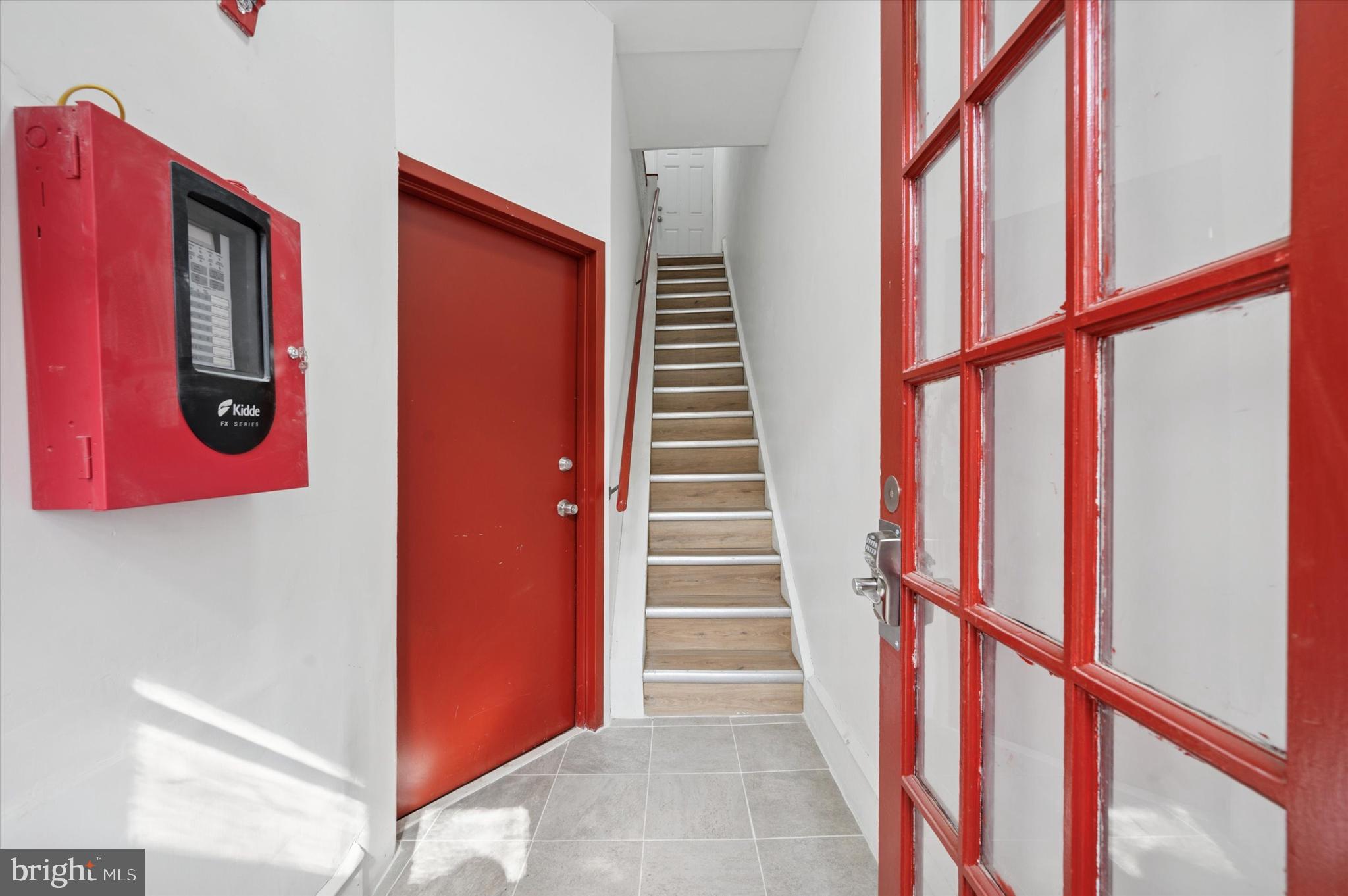 249 South 44th Street, Unit 4 Philadelphia, PA 19104 - Photo 3 of 25 a view of staircase with wooden floor and windows