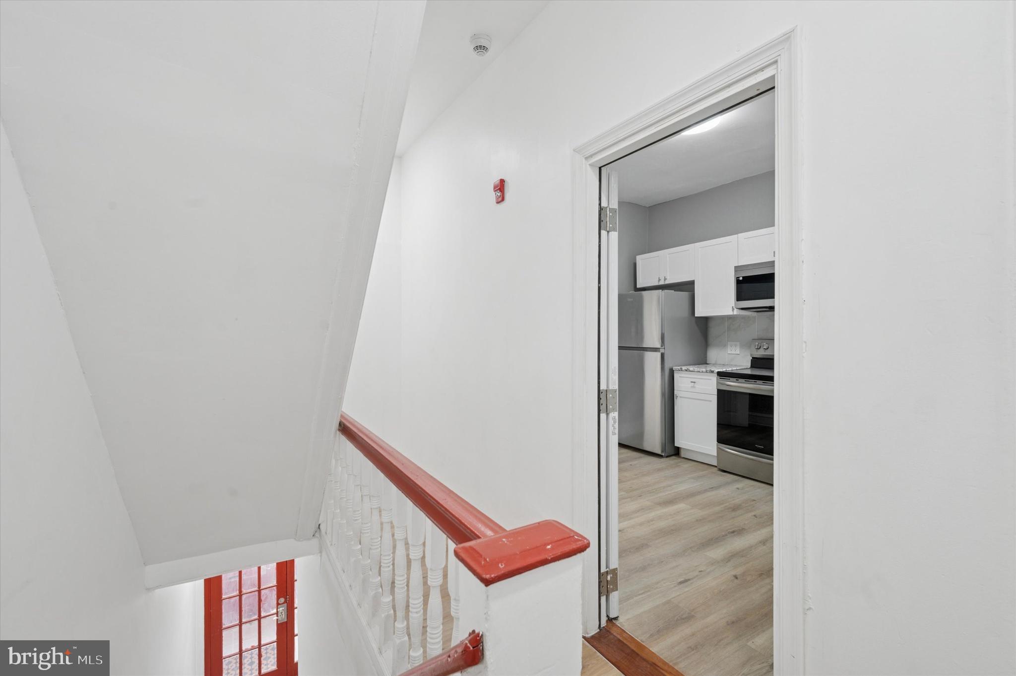 249 South 44th Street, Unit 4 Philadelphia, PA 19104 - Photo 4 of 25 a view of a hallway with wooden floor and entryway